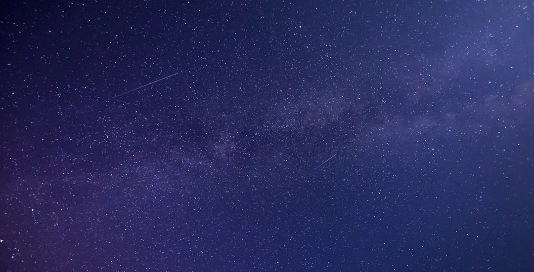 a night sky with stars and the milky