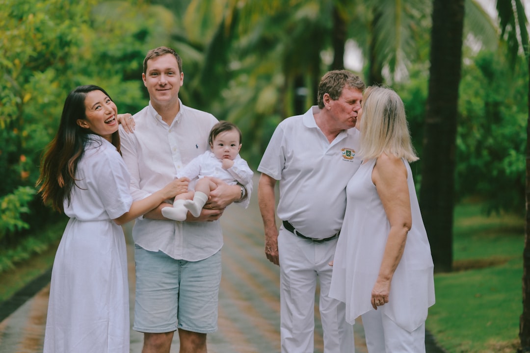Family posing for a portrait outdoors